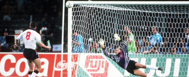 1990 World Cup Semi Final, Turin, Italy, 4th July, 1990, West Germany 1 v England 1 (West Germany win 4-3 on penalties), England's Chris Waddle fires his penalty over the bar past the dive of West German goalkeeper Bodo Illgner in the shoot -out, The penalty miss meant that England were eliminated from the tournament and West Germany reached their third consecutive World Cup Final  (Photo by Bob Thomas/Getty Images)